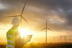 Silhouette of Technician Engineer at Wind Turbine